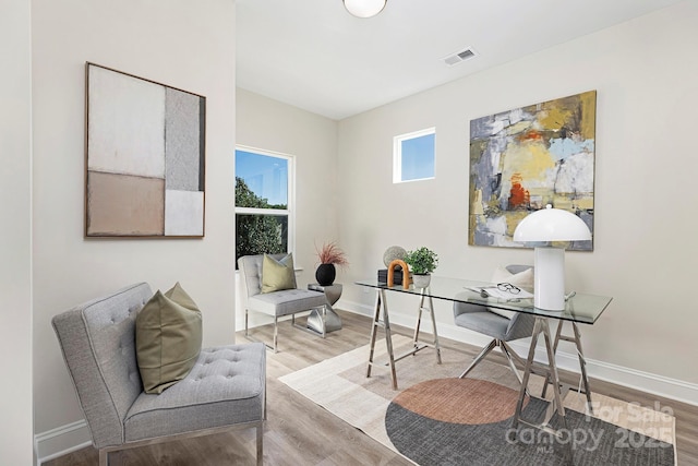 office space with hardwood / wood-style floors