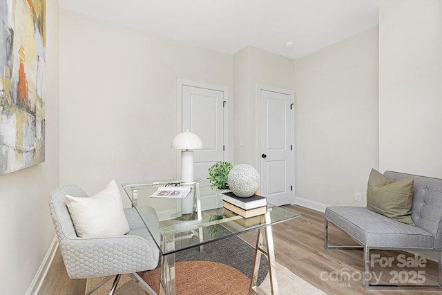 office space with light hardwood / wood-style floors