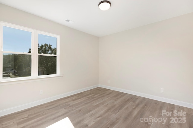 empty room featuring light hardwood / wood-style floors