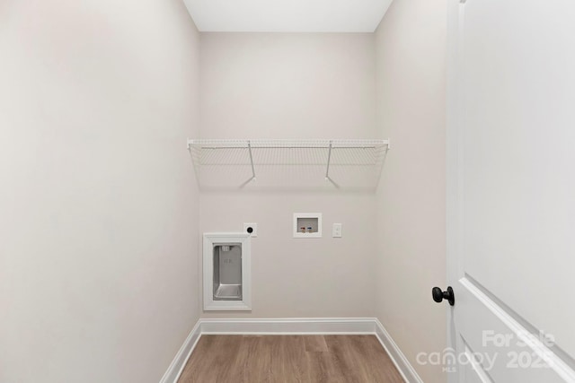 clothes washing area with hookup for a washing machine, hardwood / wood-style floors, and hookup for an electric dryer