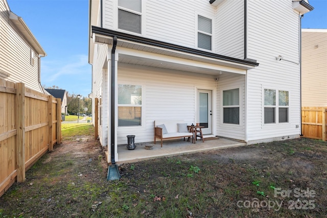 rear view of house featuring a patio