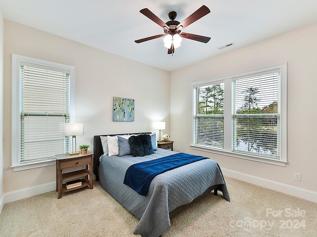 bedroom featuring ceiling fan and carpet floors