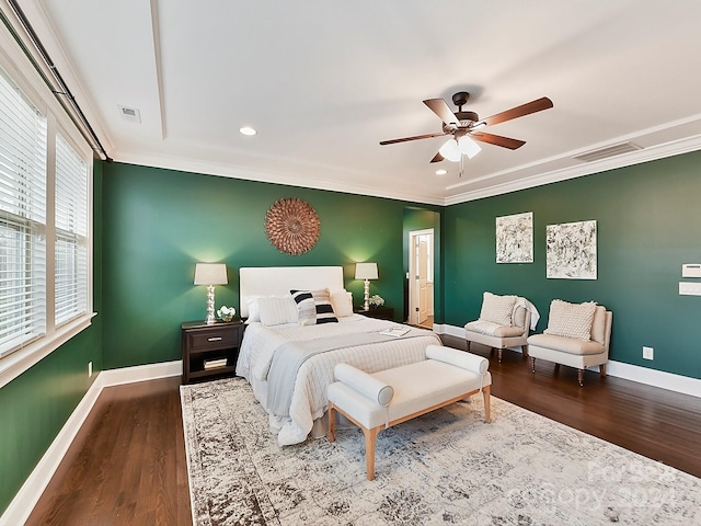 bedroom with ceiling fan, crown molding, and hardwood / wood-style flooring