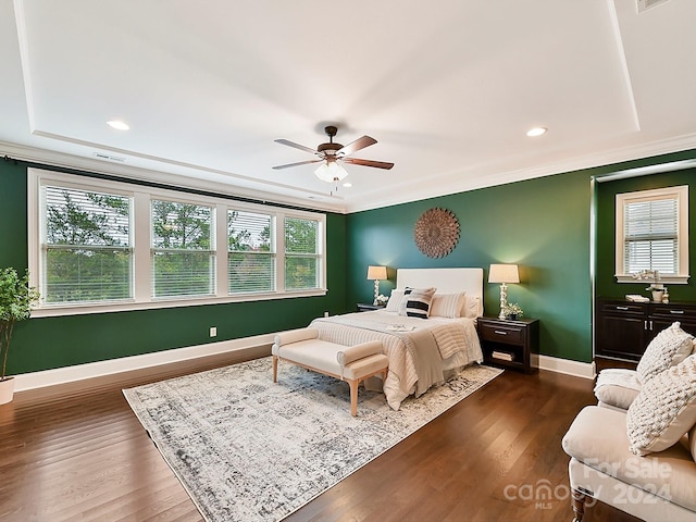 bedroom with multiple windows, ceiling fan, and dark hardwood / wood-style floors