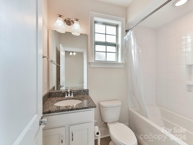 full bathroom with vanity, toilet, and shower / bath combo with shower curtain