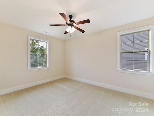 carpeted empty room with ceiling fan