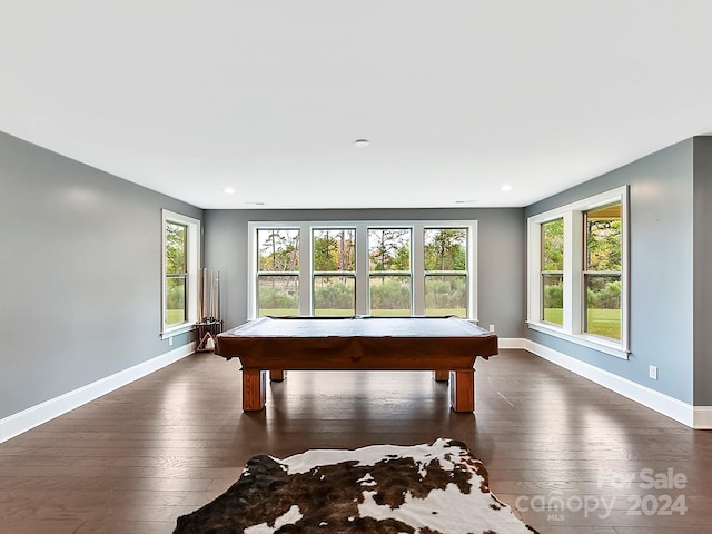 recreation room with plenty of natural light, dark hardwood / wood-style floors, and pool table