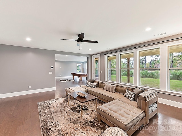 living room with ceiling fan, dark hardwood / wood-style flooring, and billiards