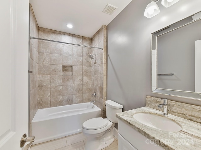 full bathroom featuring vanity, toilet, and tiled shower / bath