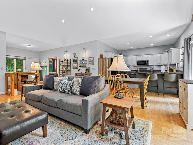 living room with light hardwood / wood-style flooring