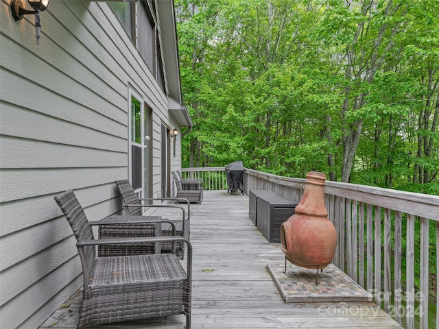 deck featuring a grill