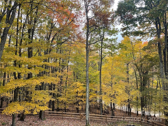 exterior space featuring a forest view