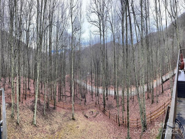 view of landscape with a forest view