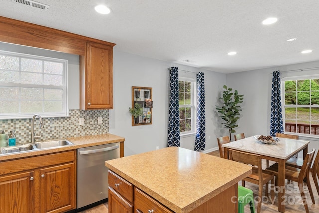 kitchen with visible vents, stainless steel dishwasher, recessed lighting, and a sink