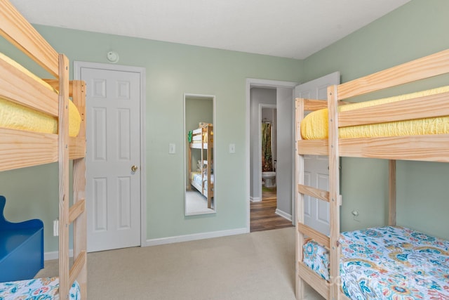 bedroom featuring baseboards and carpet floors