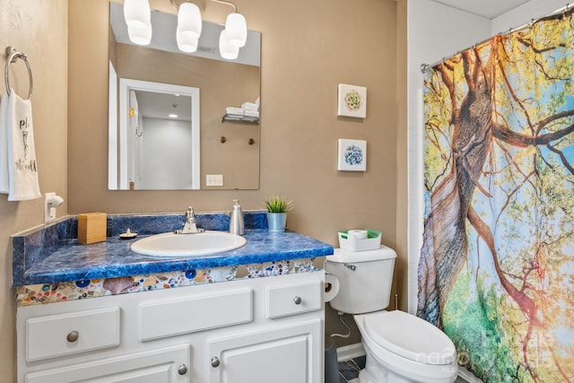 bathroom featuring vanity, toilet, and a shower with curtain