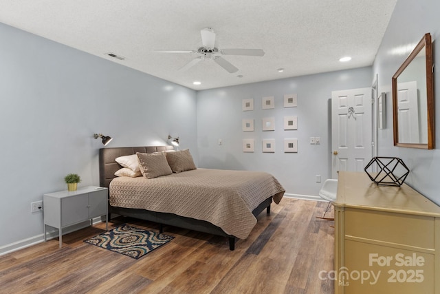 bedroom featuring visible vents, recessed lighting, wood finished floors, and ceiling fan