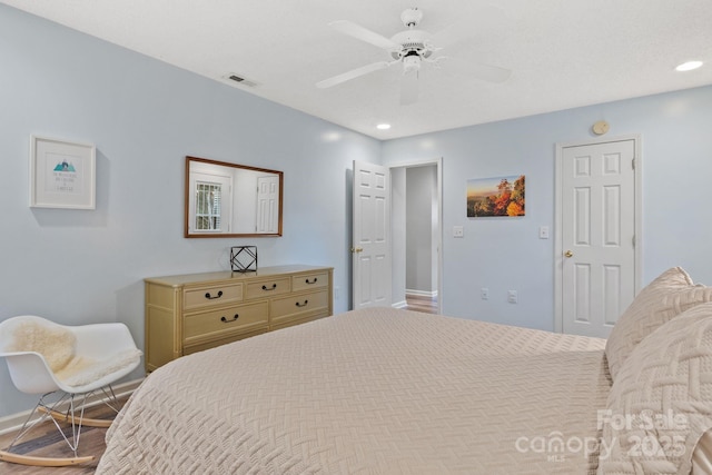 bedroom featuring recessed lighting, wood finished floors, ceiling fan, baseboards, and visible vents