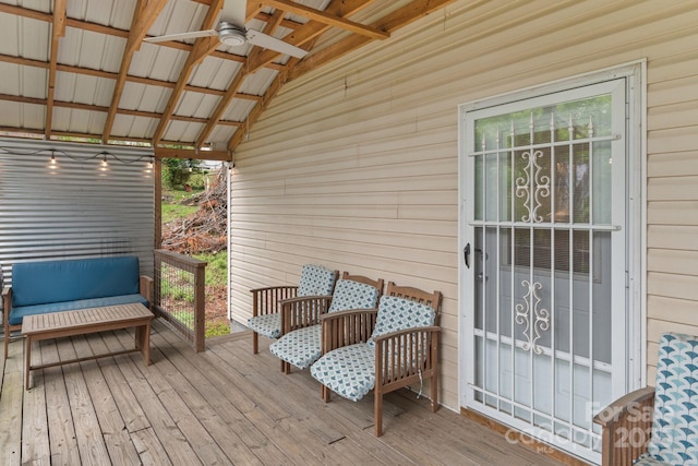 wooden deck with a ceiling fan