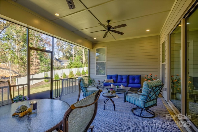 sunroom / solarium with ceiling fan