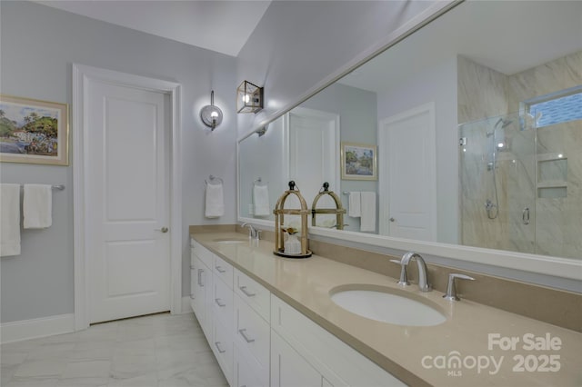 bathroom featuring a shower with shower door and vanity