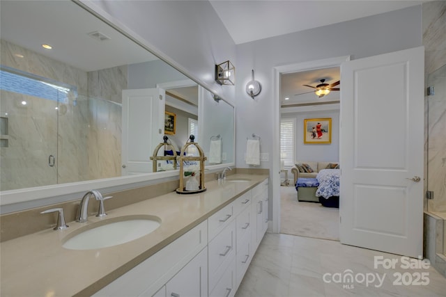 bathroom featuring ceiling fan, an enclosed shower, and vanity