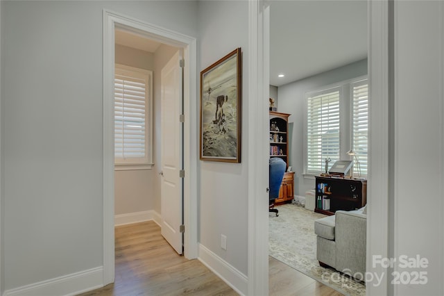 corridor featuring light hardwood / wood-style floors