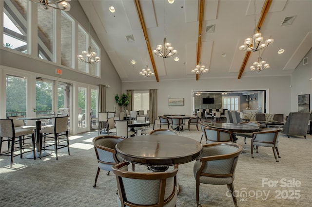 carpeted dining room with high vaulted ceiling and beam ceiling