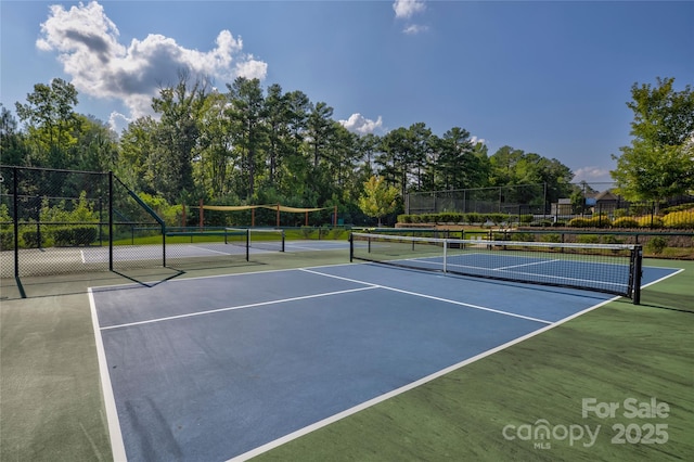 view of tennis court featuring basketball court