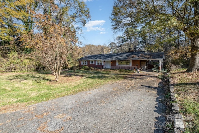 ranch-style house with a front lawn