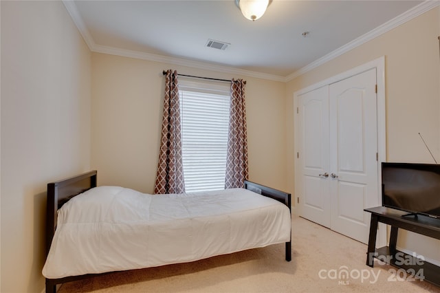 4335 Laurel Hill Ln, Charlotte, NC 28217 - bedroom featuring crown molding, a closet, and light colored carpet