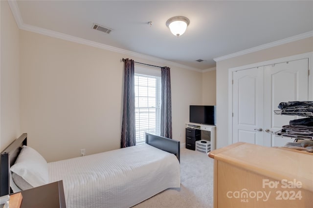 4335 Laurel Hill Ln, Charlotte, NC 28217 - carpeted bedroom featuring ornamental molding and a closet