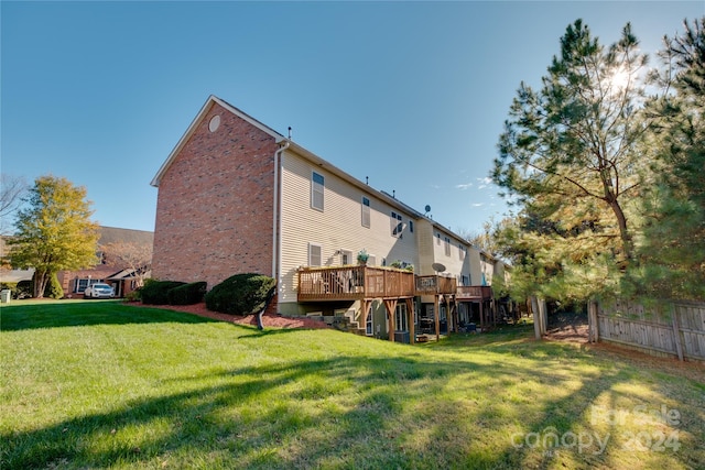 4335 Laurel Hill Ln, Charlotte, NC 28217 - back of house with a lawn and a wooden deck