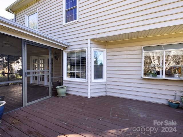 wooden terrace with a sunroom