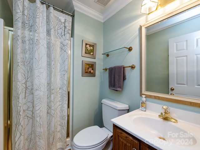 bathroom featuring a shower with curtain, crown molding, vanity, and toilet