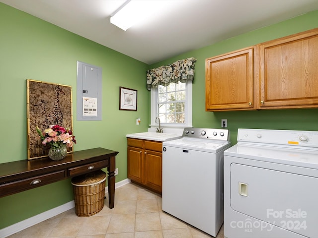 clothes washing area with sink, cabinets, independent washer and dryer, electric panel, and light tile patterned floors