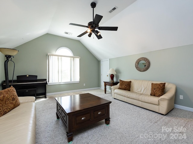 living room featuring light carpet, ceiling fan, and lofted ceiling