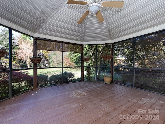 unfurnished sunroom featuring ceiling fan and lofted ceiling