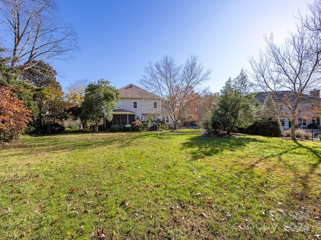 view of yard featuring a sunroom