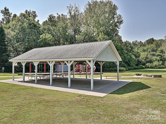 view of home's community featuring a lawn, a fire pit, a gazebo, and a playground