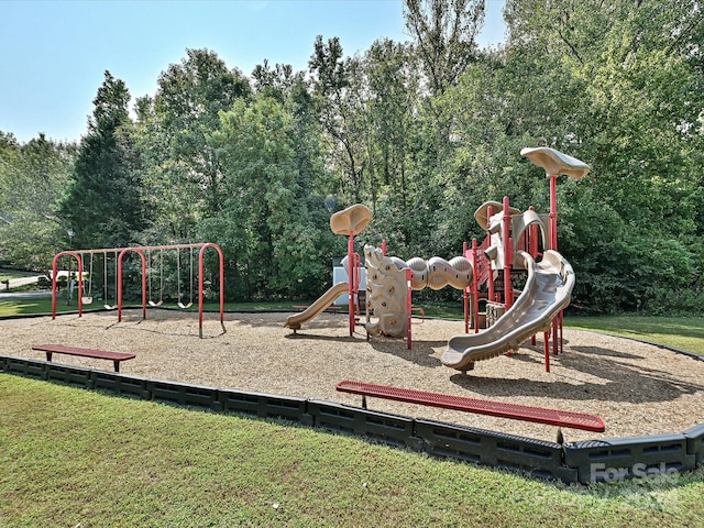 view of jungle gym with a lawn