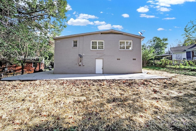 back of property featuring a patio