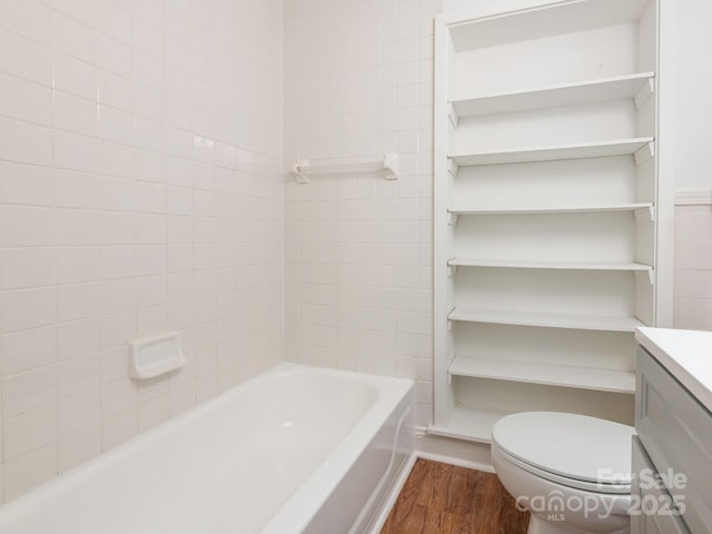 full bath with vanity, toilet, and wood finished floors