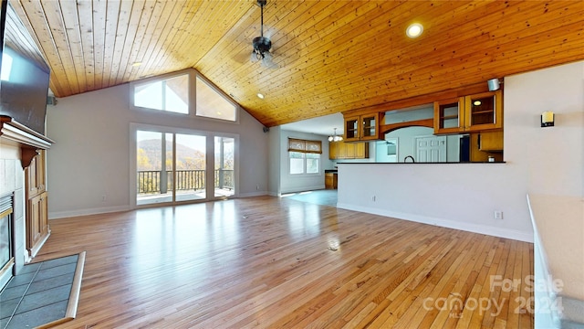 unfurnished living room with a fireplace, high vaulted ceiling, wooden ceiling, and light hardwood / wood-style flooring