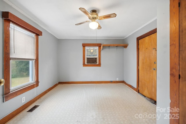 unfurnished room with cooling unit, ceiling fan, and ornamental molding