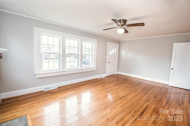 interior space featuring crown molding, light hardwood / wood-style flooring, and ceiling fan