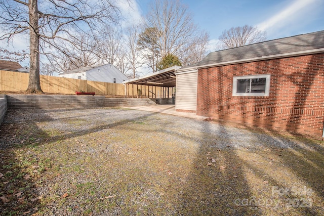 exterior space with a carport