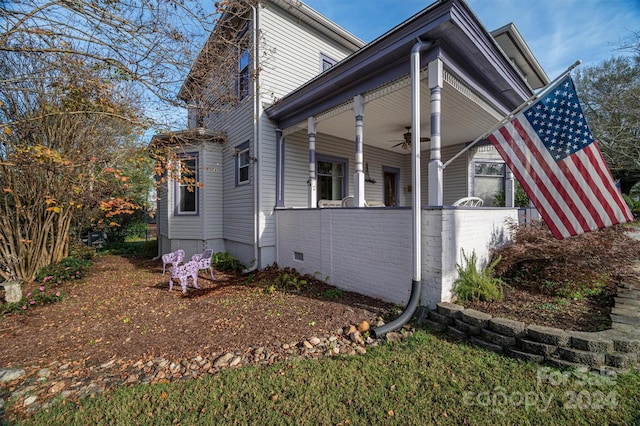 view of side of home with a porch