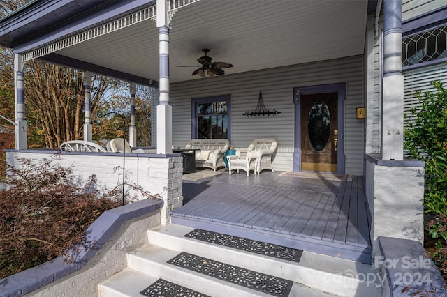 exterior space with ceiling fan and a porch