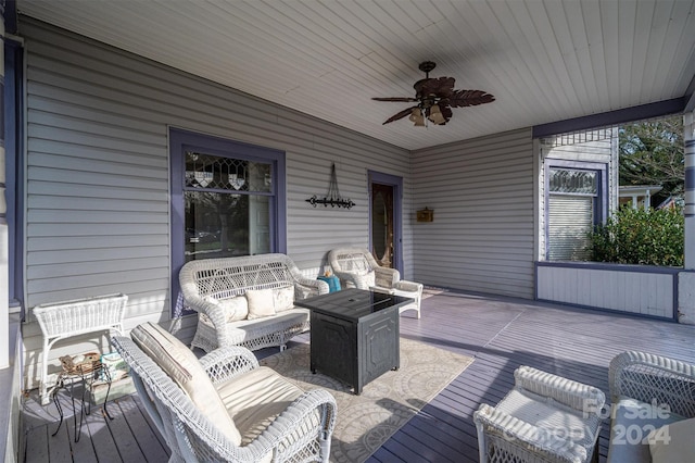 deck featuring ceiling fan and an outdoor hangout area